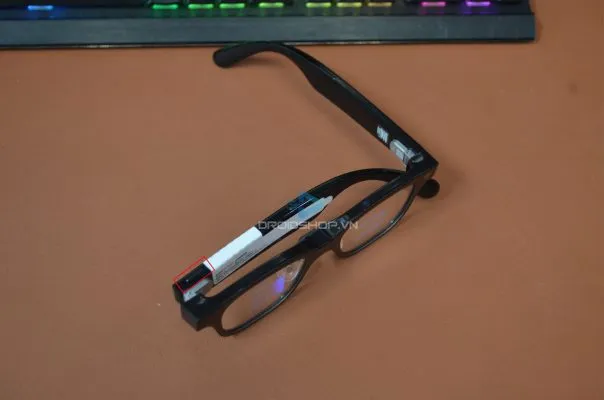 Fold the right temple and press the camera button 3 times to enter pairing mode